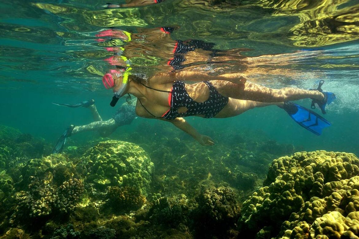 beautiful-lady-snorkeling-inside-maui-oceans