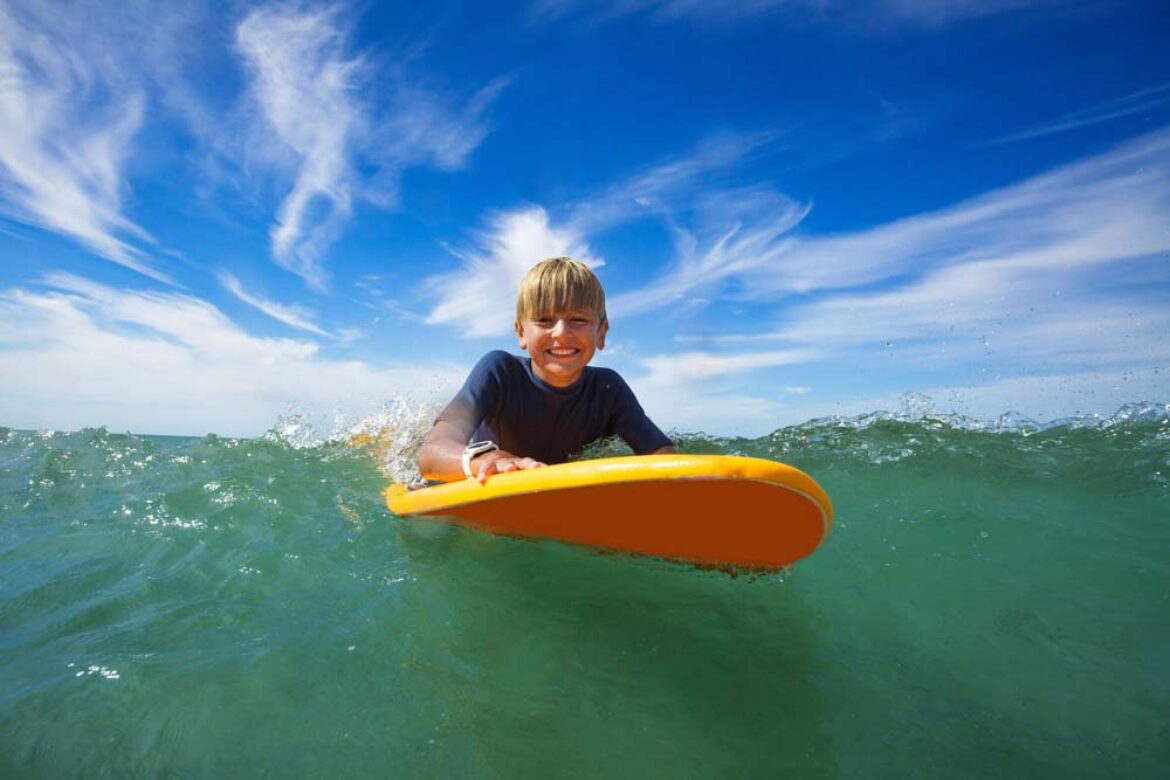 boy-enjoy-the-surfing-on-maui-ocean