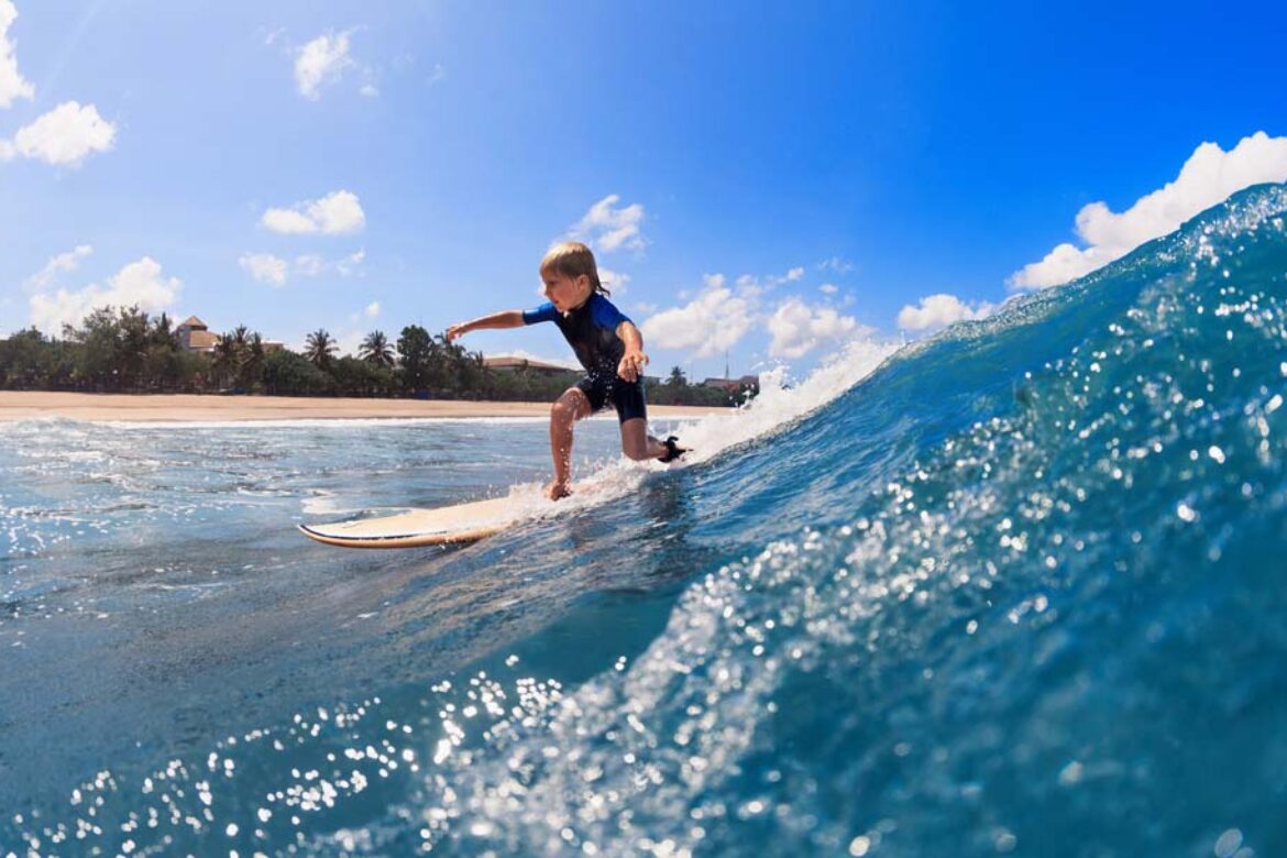 little-boy-confidently-surfing-on-maui-waves