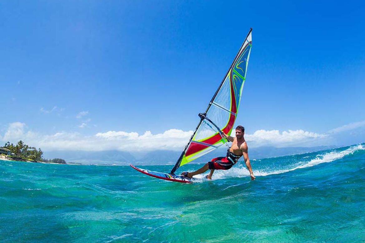 man-windsurfing-on-maui-ocean-waves