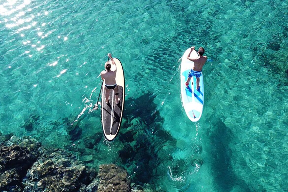 two-men-stand-up-paddling-in-maui-ocean